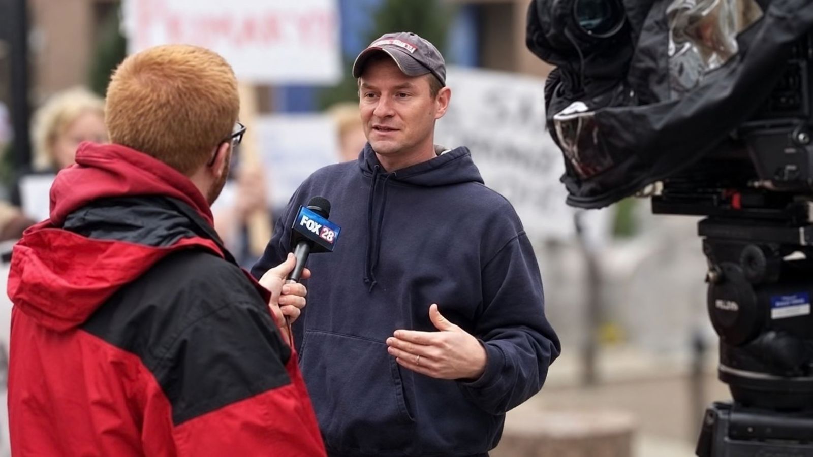 Ted Stevenot speaking to a local Cincinnati television media reporter